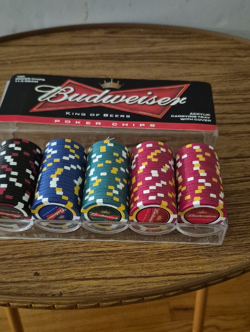 Budweiser Poker Chip Set in Black, Blue, Green, Red Gently Displayed.
